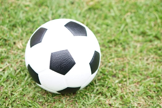 Football, soccer ball on green grass field background. Concept, Sport equipment. sport, workout, exercise for health. Hobby. Football match. photo