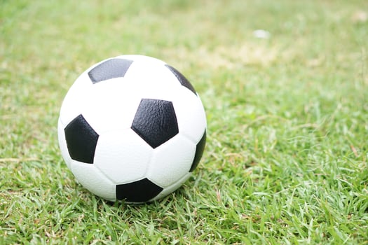 Football on green grass field background. Concept, Sport equipment. sport, workout, exercise for health. Hobby. Football match. photo