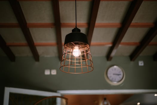 Pendant Light Fixture with Filament Bulb and Interior Design Element photo