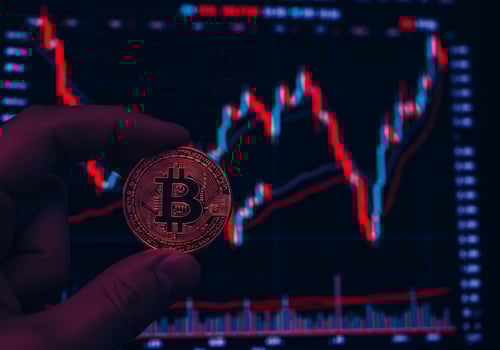 Hand Holding Bitcoin Coin on White Background photo