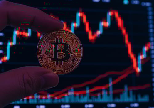 Close up of Hand Holding Bitcoin Coin on a white background photo
