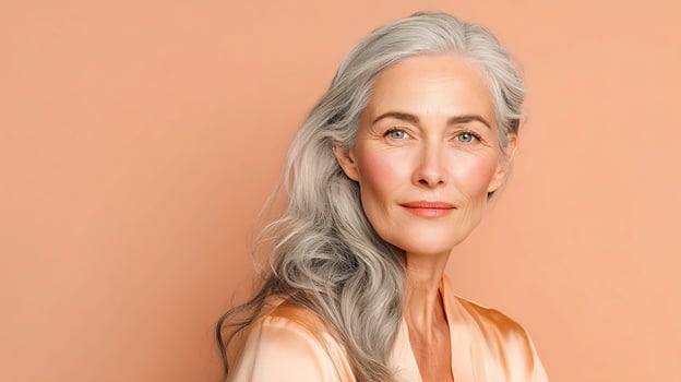 An older woman with gray hair and a smile photo
