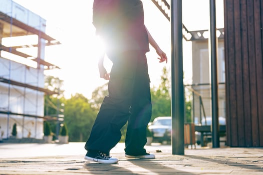 Casual walk at sunset in an urban environment with a construction backdrop photo