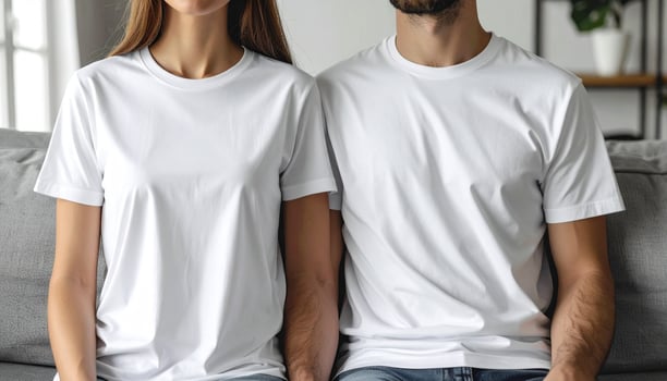 Couple wearing white T-shirts relaxing on couch photo