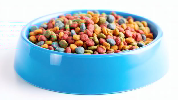 A blue bowl filled with colorful dog food photo