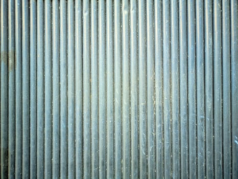 a close up of a metal door with a metal bar photo