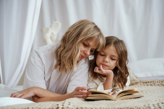 Reading the book together..,, Mother with daughter are at home photo
