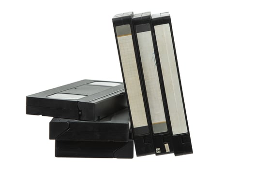 Pile of Vintage VHS Tapes with Blank Labels photo