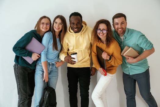 Positive ,friends.. Group of young people are standing against white background photo