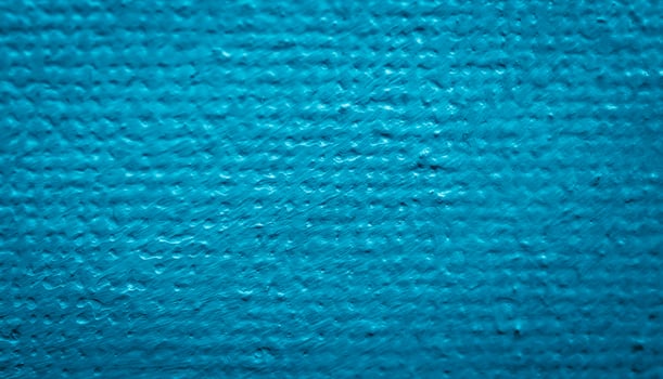 blue paint on canvas with visible texture photo