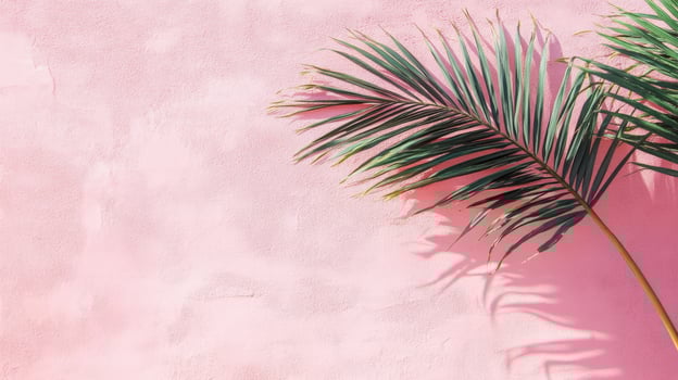 Two palm fronds against a textured pink wall in bright sunlight, casting soft shadows. Tropical and summery botanical background with copy space photo