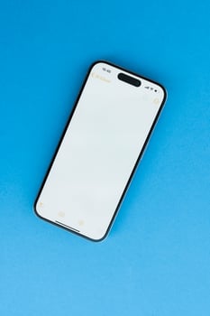 Modern Smartphone With Blank Screen On Blue photo