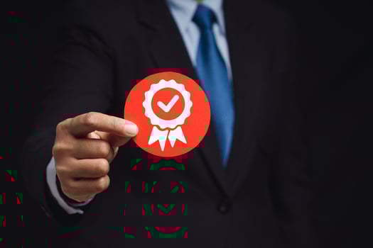 The best quality symbol assurance for a product, service, and ISO certification on a hand businessman. photo