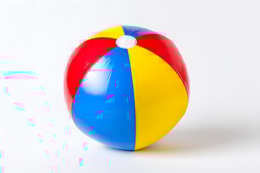 Colorful beach ball isolated on white background ready for fun summer outdoor activities photo