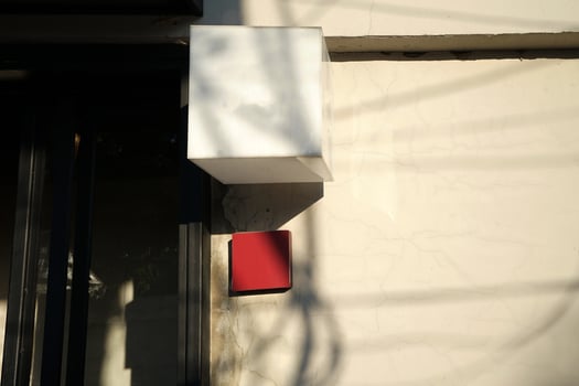 Exterior store design and front decoration of coffee cafe and restaurant decorated with cube shaped lamp and metal frame gate photo
