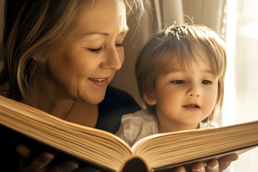 A heartwarming moment of a young boy and his mother reading a book together at home, enjoying quality time and bonding over a story photo
