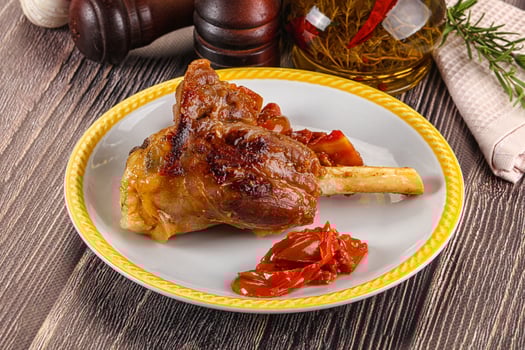A plate of food with a meat on it photo