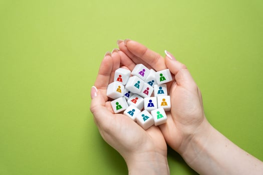 Cubes with people in palms. Human resources department. Recruitment and management of employees photo