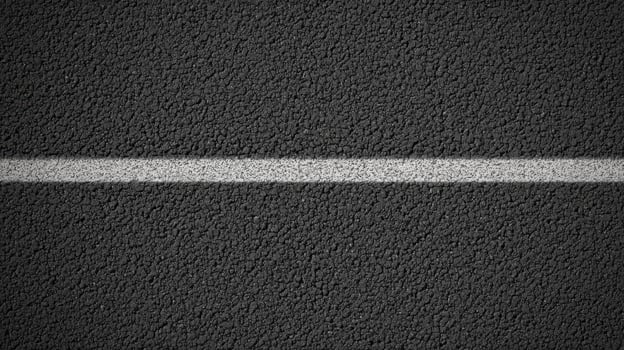 Close-up view of gray asphalt road with white divider line for urban concept photo