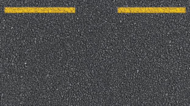 Top view of asphalt road with yellow lines showing urban transportation concept photo