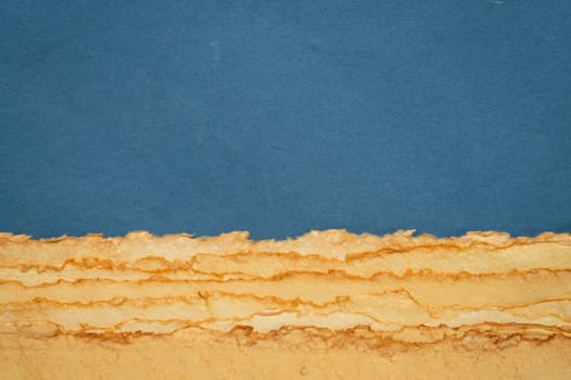 abstract desert landscape created with sheets of textured handmade paper photo