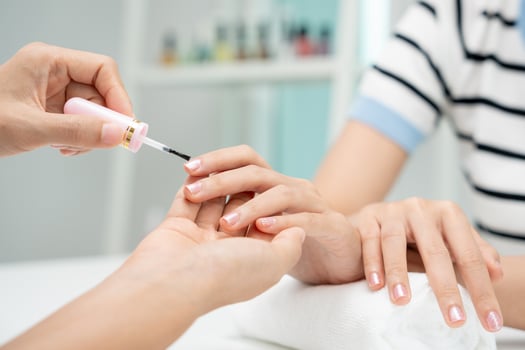 Female receive care service by professional Beautician Manicure at spa centre. Nail beauty salon use nail file for Glazing treatment. manicurist make nail customer to beautiful, body care photo