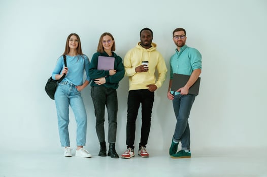 Against white, background.. Group of friends are in the studio photo