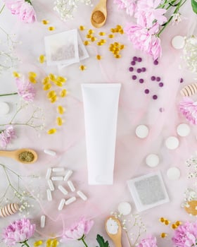 Self care composition with cosmetic tube with cream, tea bags and vitamins photo