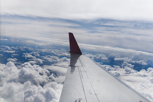 Commercial airplane while flying against a clear blue sky photo