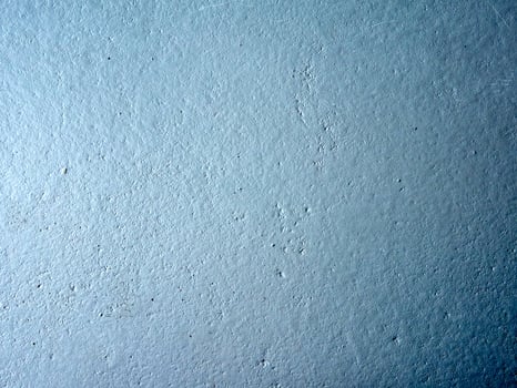 Blue wall with a rough texture photo