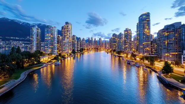 The city of vancouver is seen from a river photo