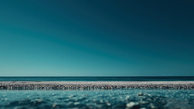 A body of water with a blue sky in the background photo