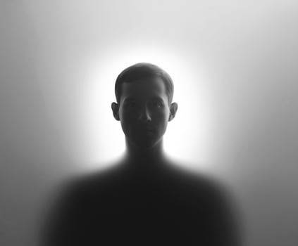 Man's face is shown in a silhouette photo