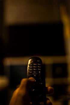 Use the TV remote In Dark Room photo
