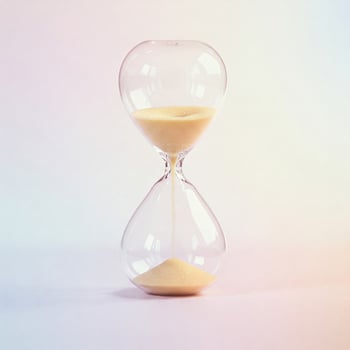 Minimalist image of a sand clock in bright pastel tones photo