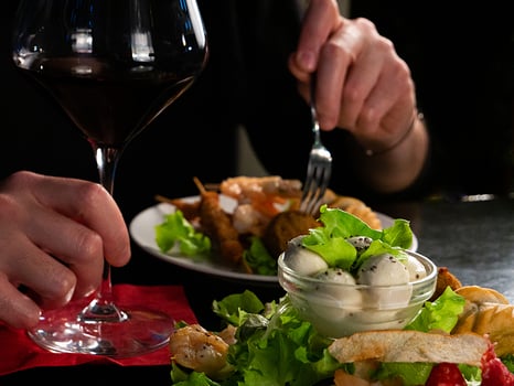 A Culinary Moment Red Wine Accompanies a Delectable Plate of Mixed Appetizers photo