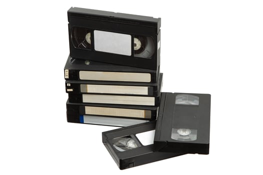 Pile of old VHS cassettes symbolizing vintage home media photo