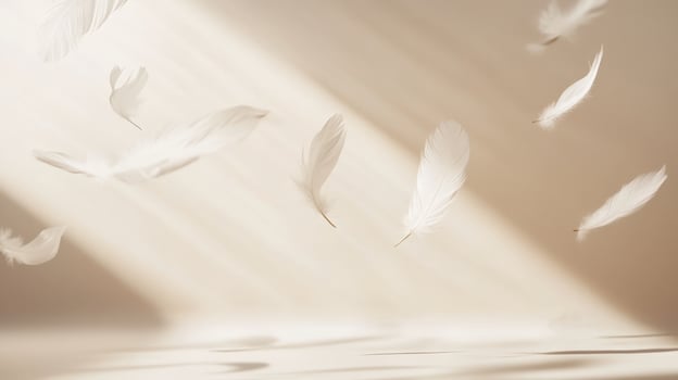 Several delicate white feathers gently falling in soft sunlight against a warm beige background with subtle shadows. Airy and peaceful composition photo