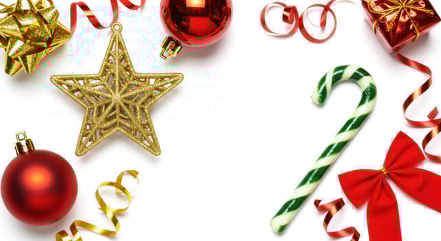Flat Lay of Christmas Decorations with Candy Cane and Ornaments on White Background photo