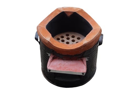 An anglo stove, a traditional charcoal-burning cooker,isolated on white background. Concept, energy-saving kitchen tool uses charcoal as fuel and is widely used for outdoor or rural cooking . photo