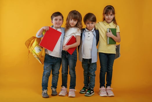 Kids ,are together against yellow background photo