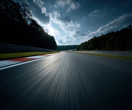 Race track curves under cloudy sky at sunset photo