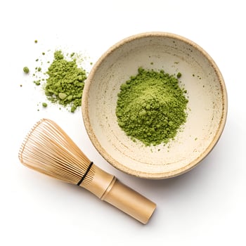 Top view, Matcha powder in a beige ceramic bowl, isolated on a white background photo