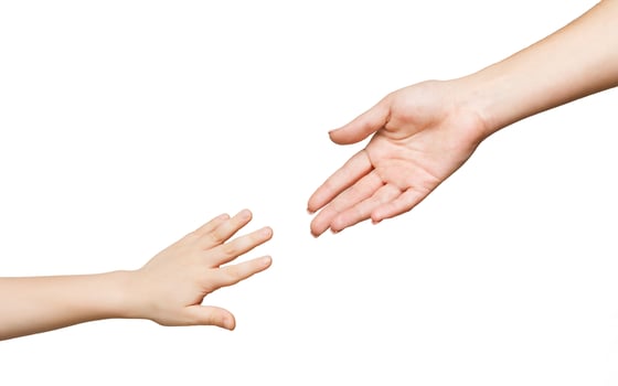 Mother and child hands reaching before touching, isolated on white background. Love, trust, family concept photo