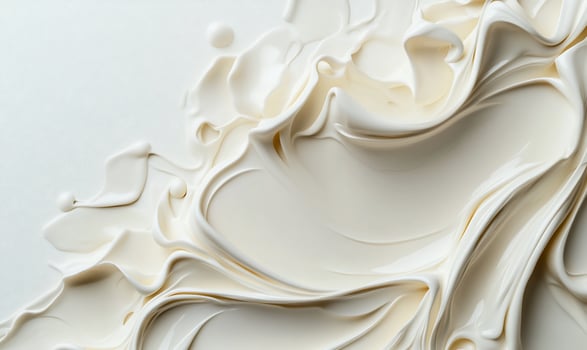 A close up of a white liquid with swirls photo