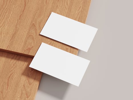 A sleek business card mockup on wood with natural lighting, perfect for presenting simple yet sophisticated brand logos. photo