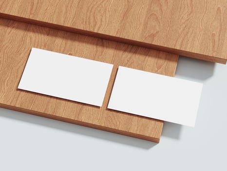 Business card mockup on a wooden background, offering an elegant and professional setting for brand identity presentations. photo