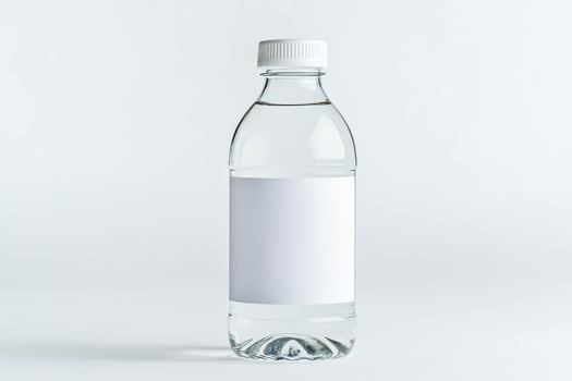 A clear plastic water bottle with blank white label for showcasing brand or product design isolated on white background photo