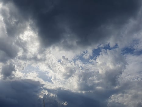 A gloomy rainy sky, covered with heavy clouds, creates an atmosphere of melancholy and comfort photo