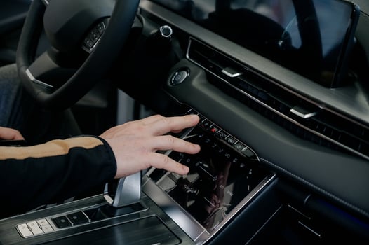 Close up of businessman using car system control. Transportation and vehicle concept photo